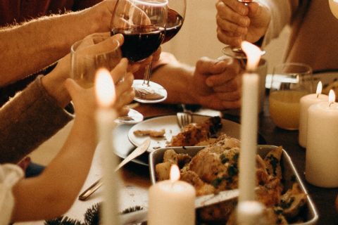 people holding wine glasses